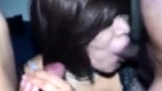 Mature Asian CD sucking 2 cocks