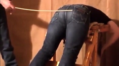 Caned over tight jeans Daddy boy