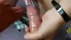 Two guys cum in one condom