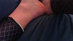 Brunette with foot fetish rubs big dick with her feet in POV