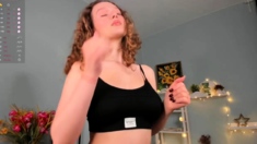 Redheaded pierced teen close up toy show