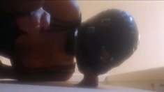 High-Heeled Milf Sucks and Fucks in a Catsuit at a Gloryhole